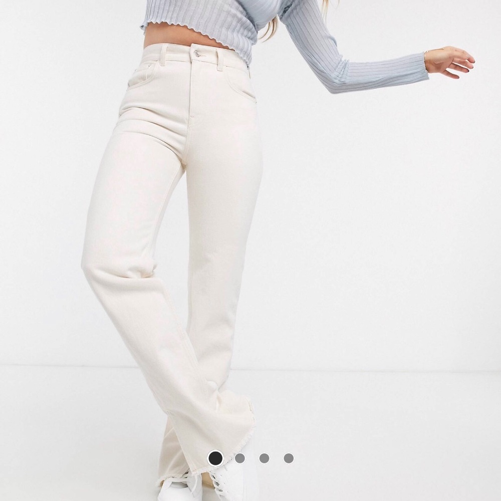 White jeans with split hem